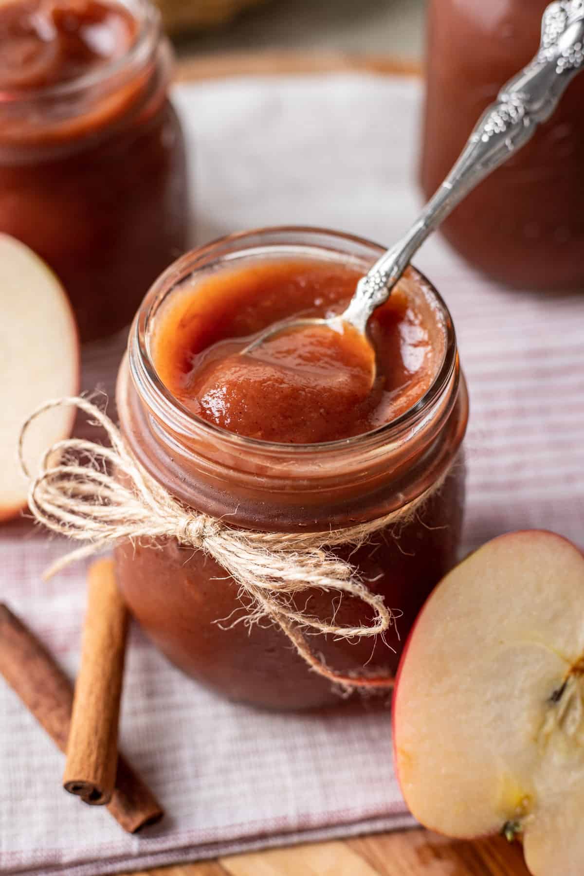A spoon showing the smooth texture of the instant pot apple butter.