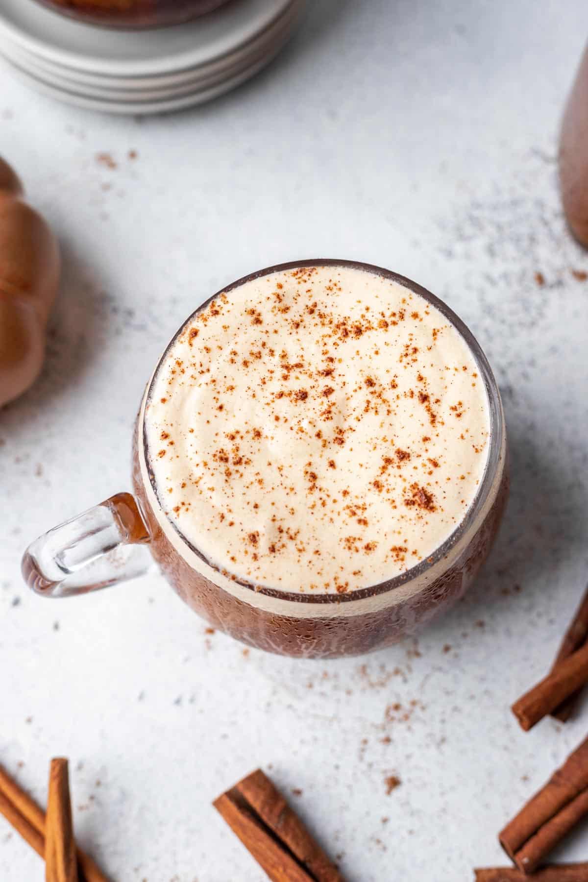 Pumpkin cold foam on top of cold brew coffee with a dusting of pumpkin pie spice on top.