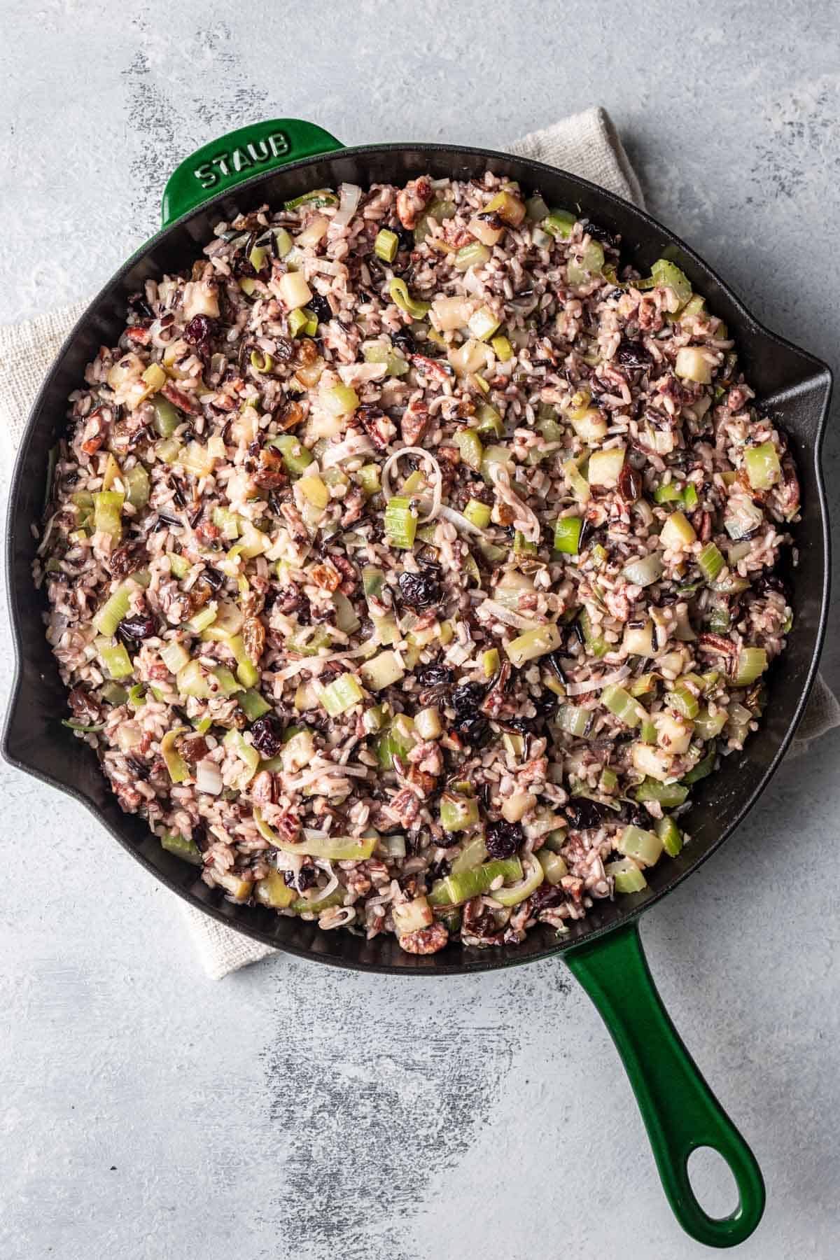 Cooked wild rice with seasonings, golden raisins, dried cranberries, and pecans.