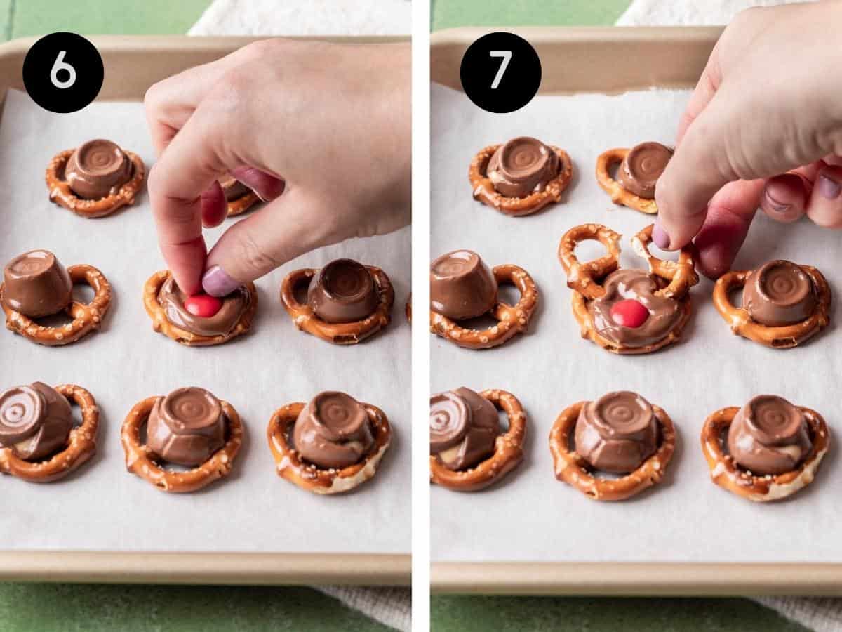 Melted rolos candies on twist pretzels with a hand adding a red m&m for the reindeer nose and 2 broken pretzels for the reindeer's antlers.