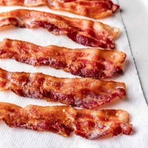 Instant pot bacon on a paper towel lined plate.