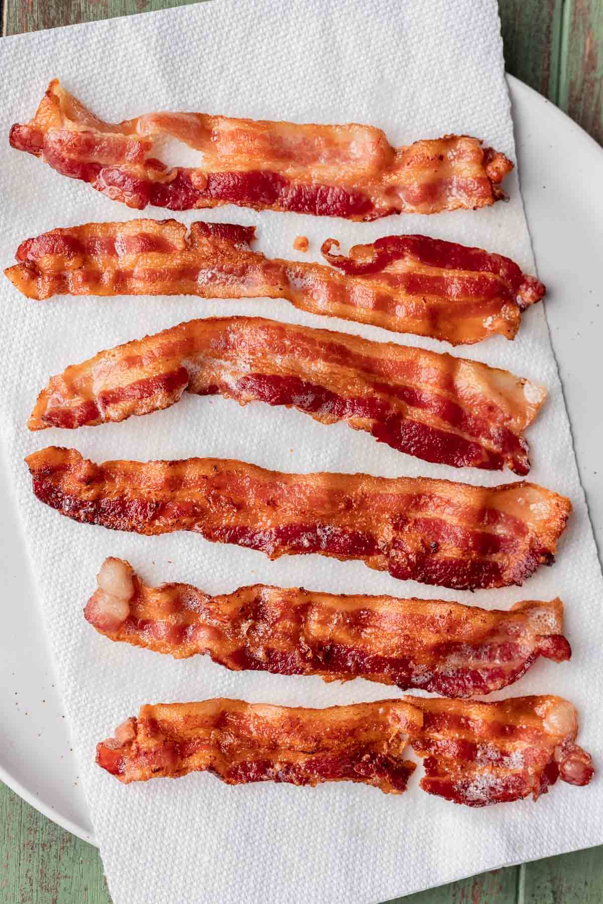 Crispy bacon on a white plate.