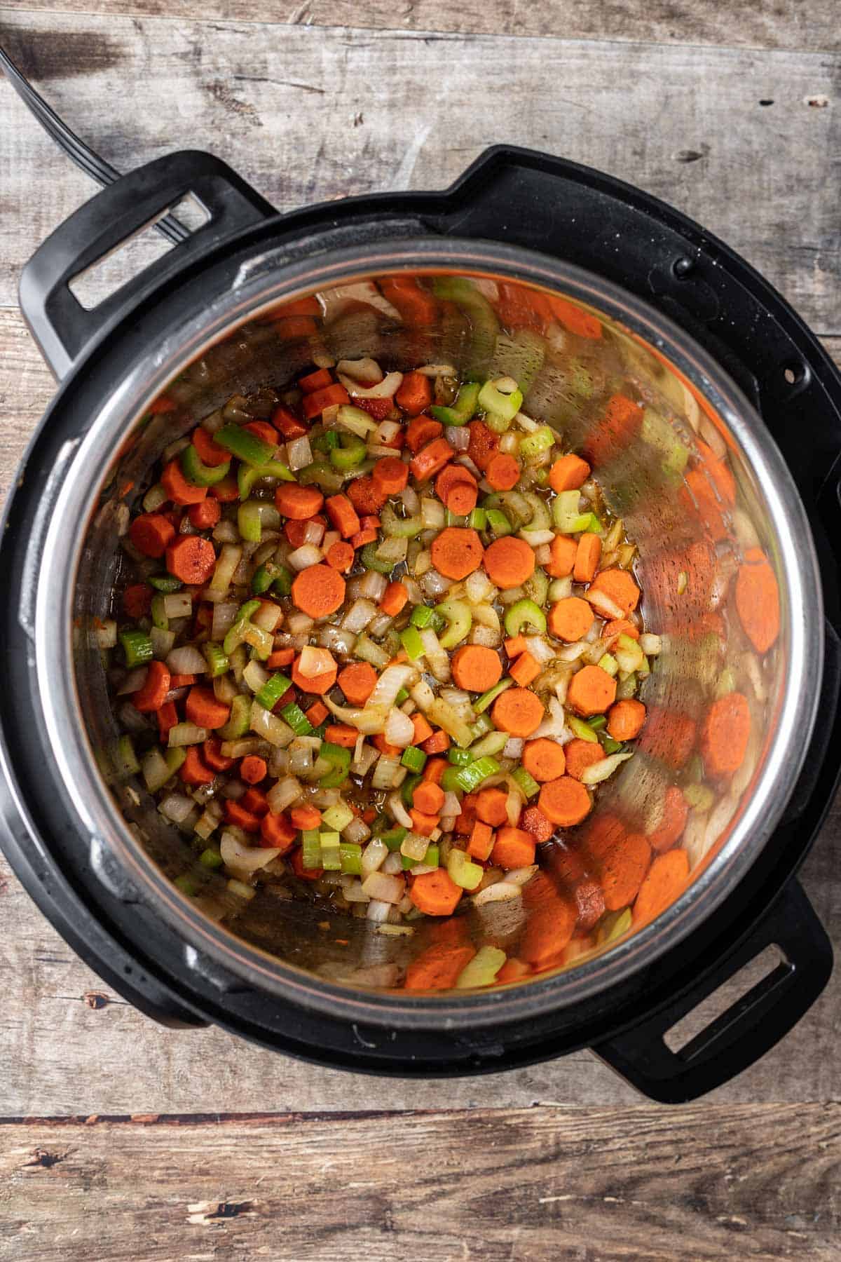 Onion, carrot, and celery added to the instant pot.