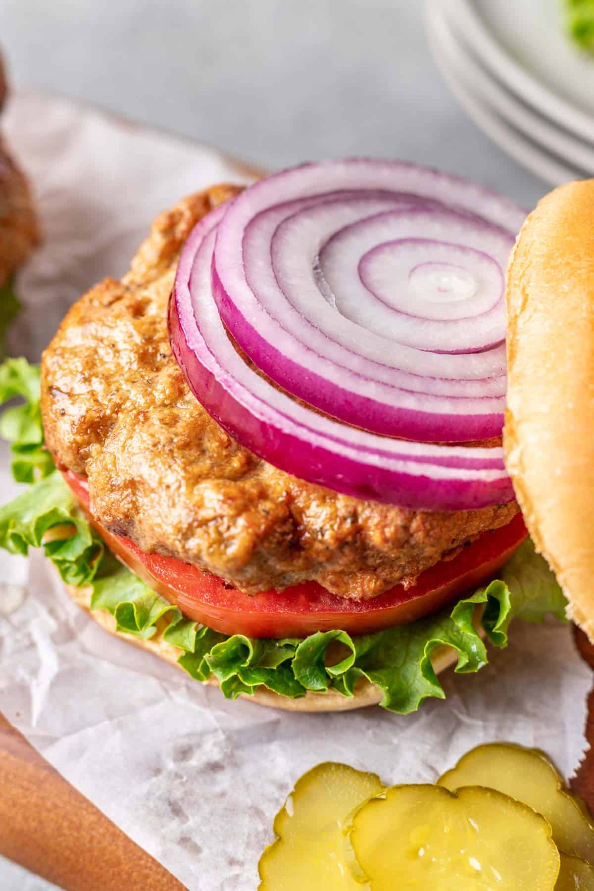 Juicy air fryer turkey burger on a bun with all the fixings.