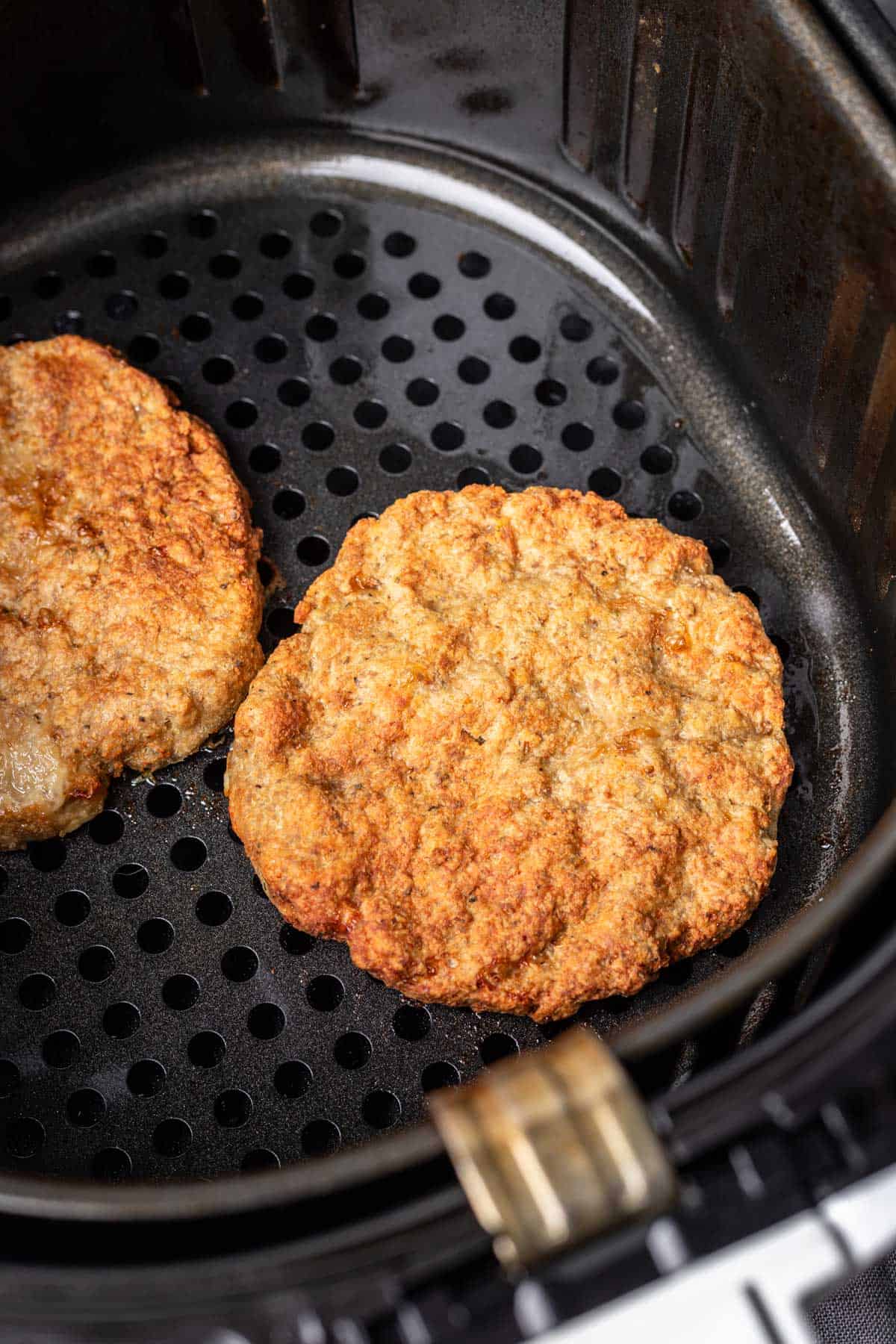 Golden brown turkey burger cooked in an air fryer.