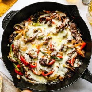 Philly cheesesteak skillet on a white background.