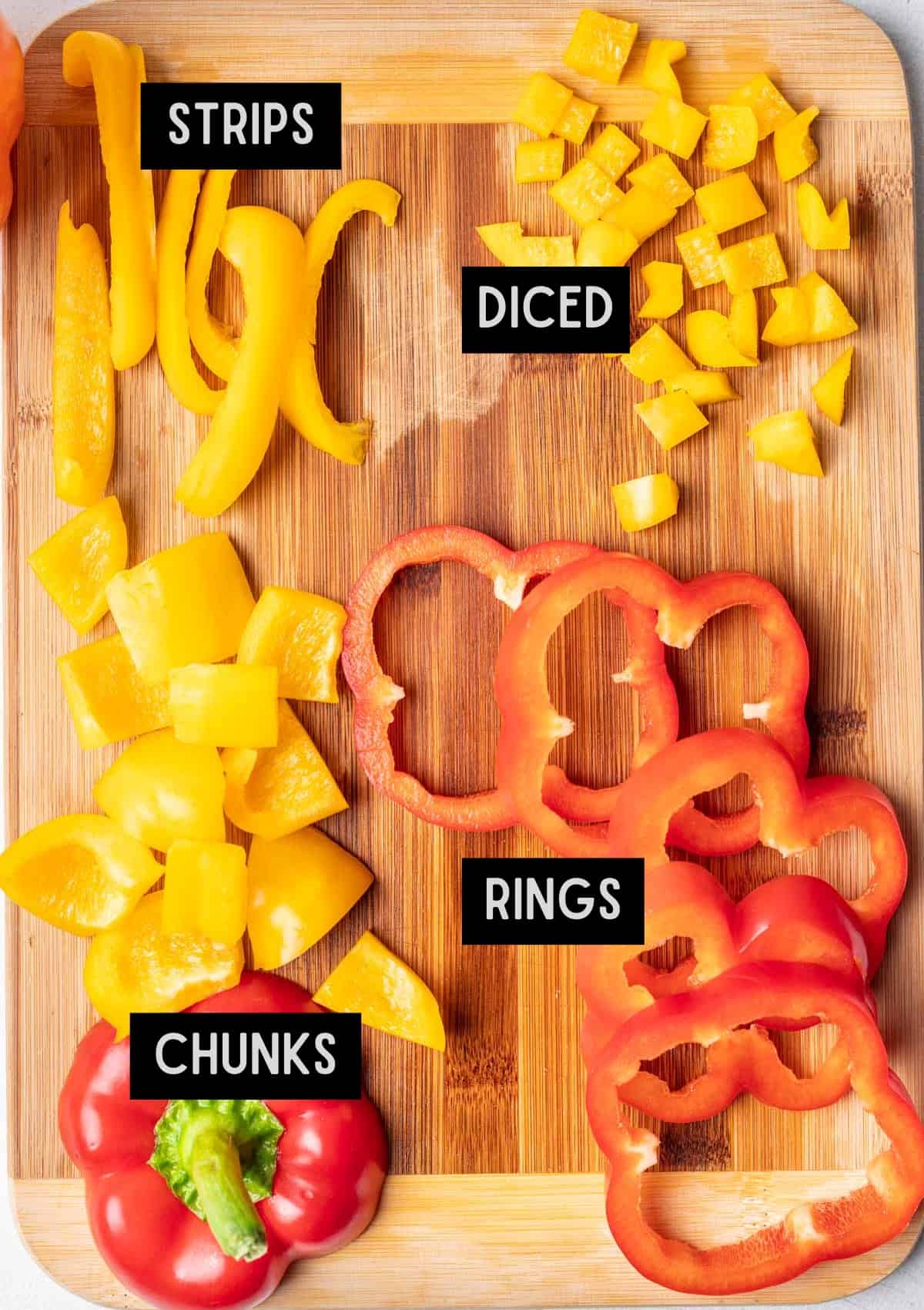 Different cuts of bell peppers on a cutting board.