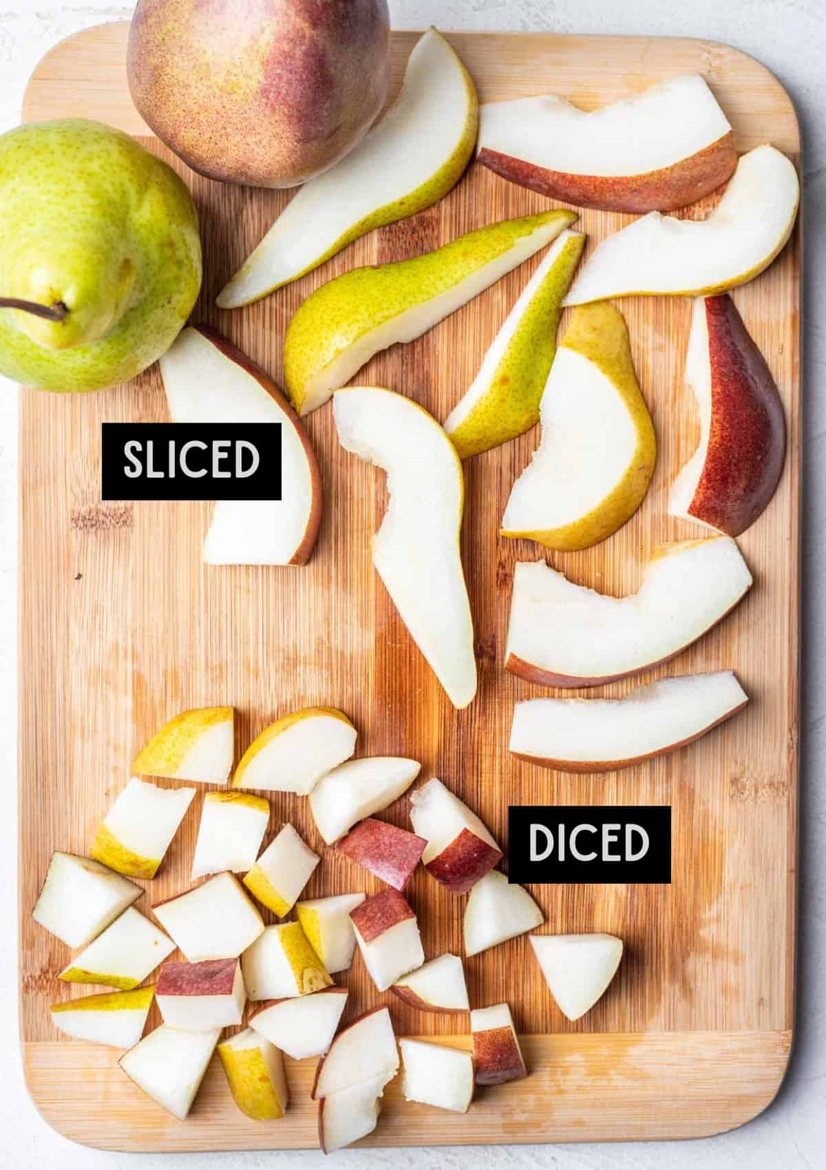 Sliced and diced pears on a cutting board.