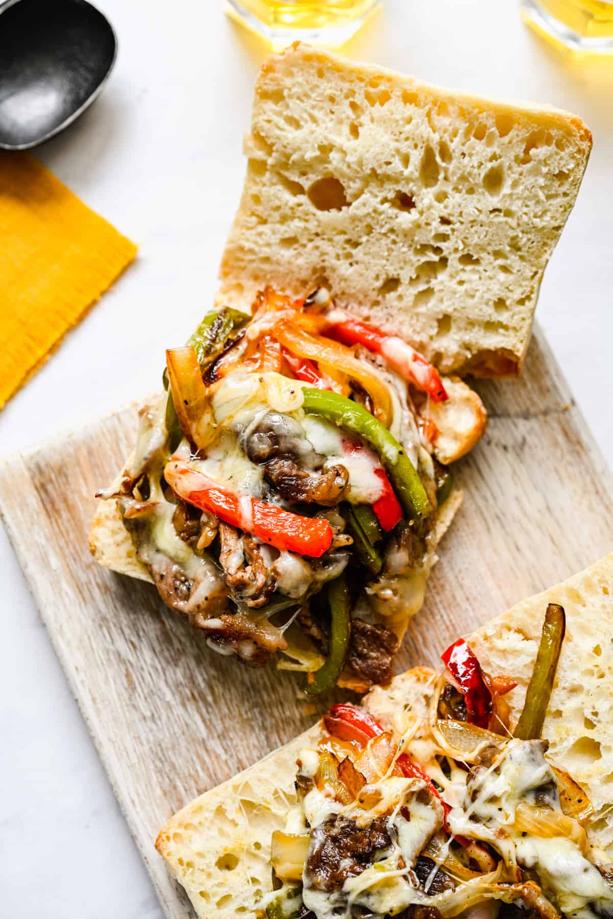 Philly cheesesteak served on crusty bread.