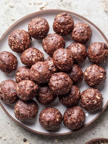 Date balls stacked on a serving plate.