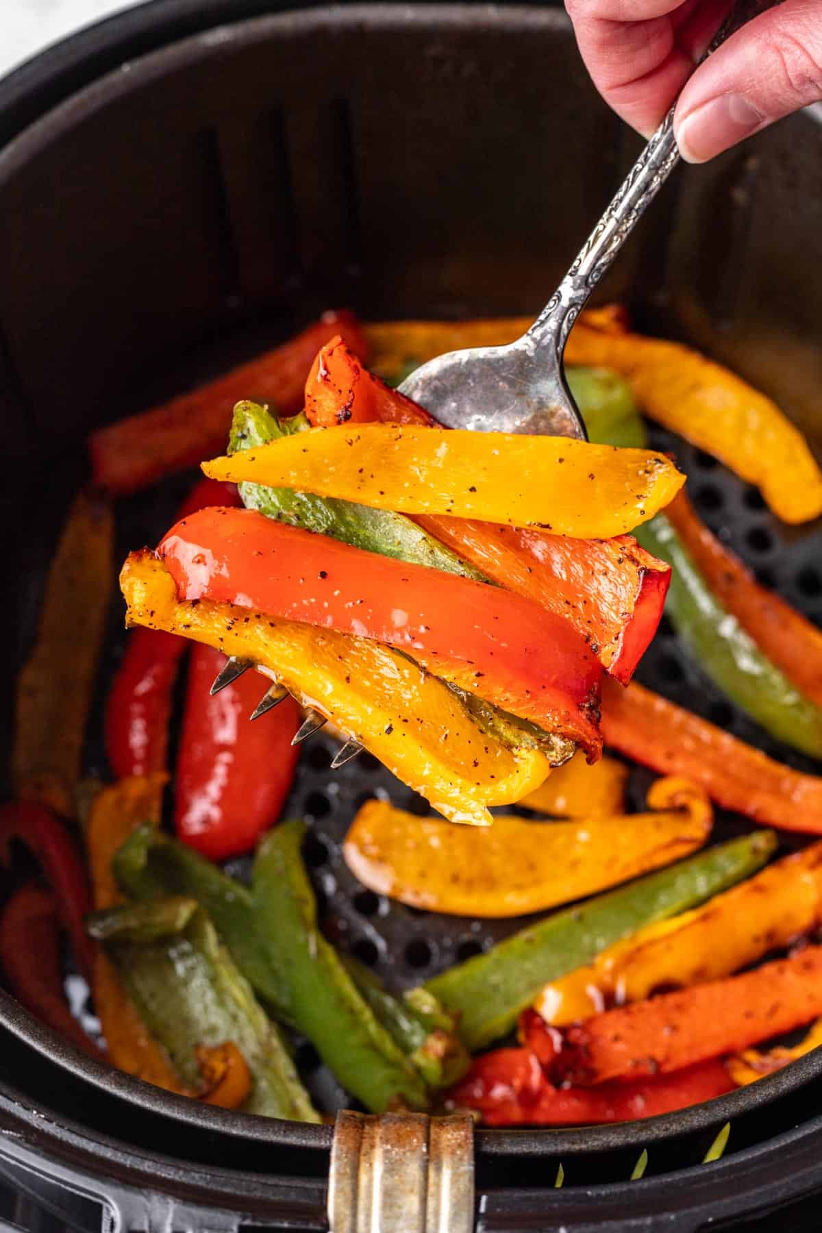 Air fryer bell peppers on a fork.