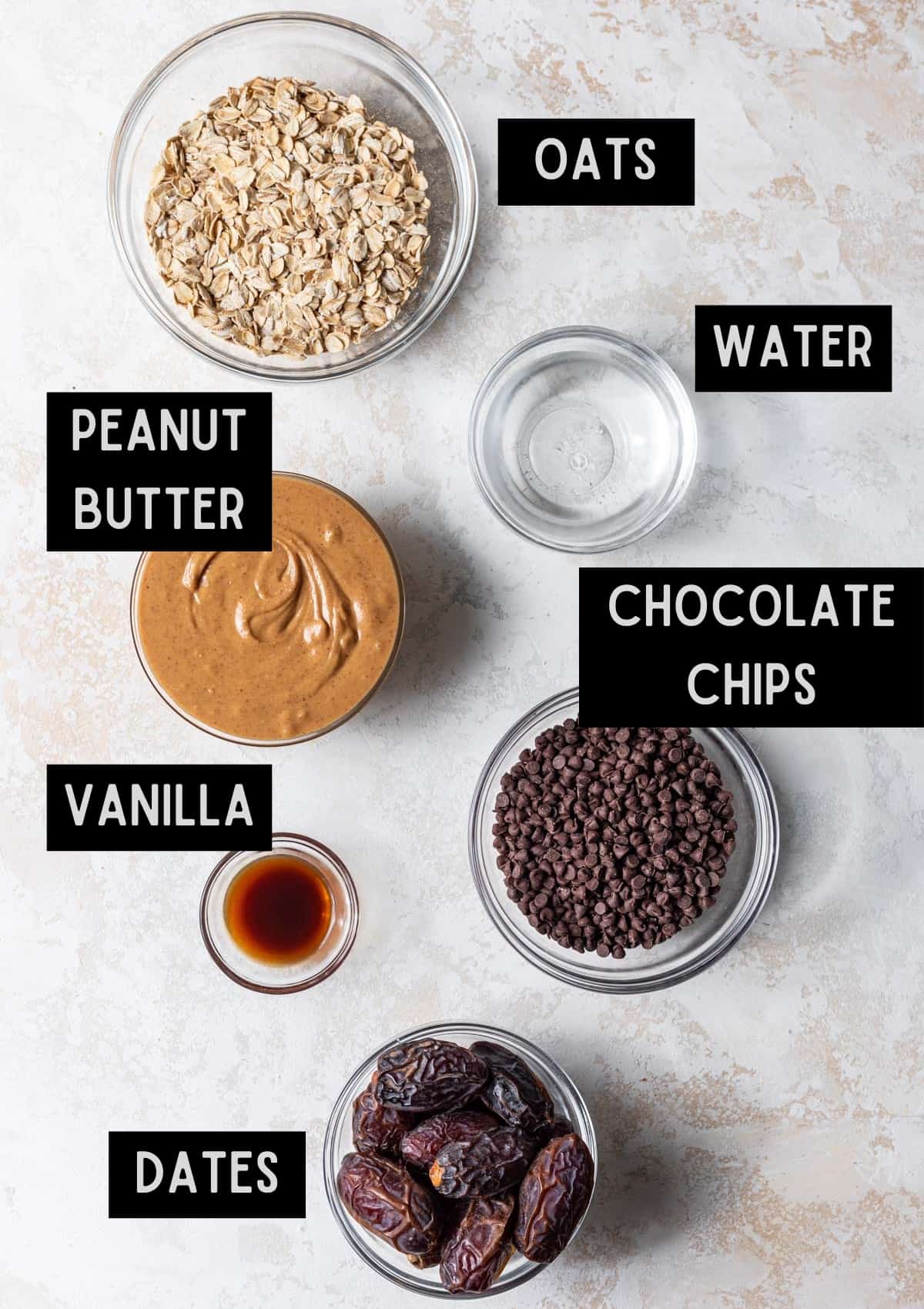 Labelled ingredients for peanut butter bliss balls (see recipe for details).