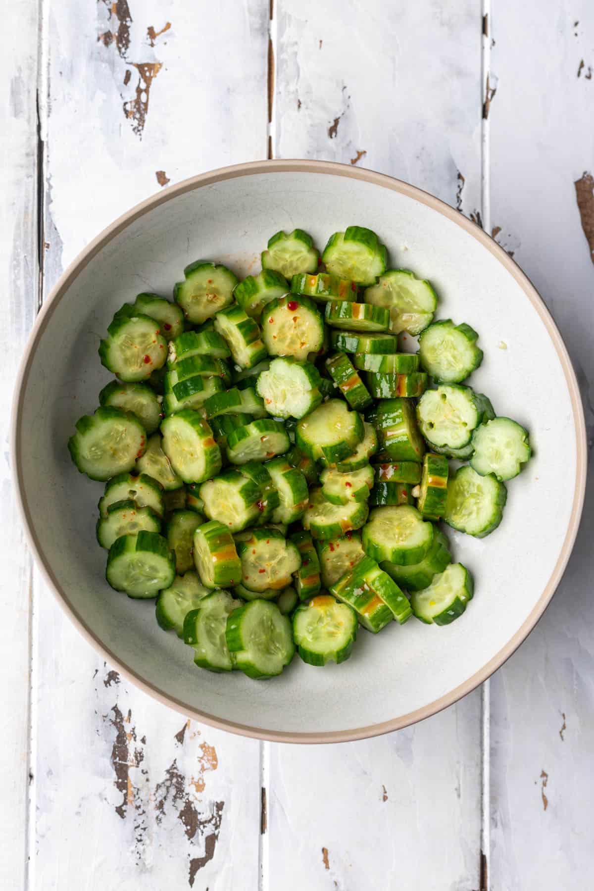 Sliced cucumbers mixed with seasonings and spicy dressing.