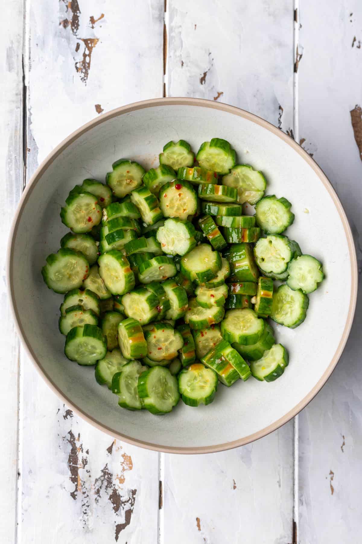 Sliced cucumbers mixed with seasonings and spicy dressing.