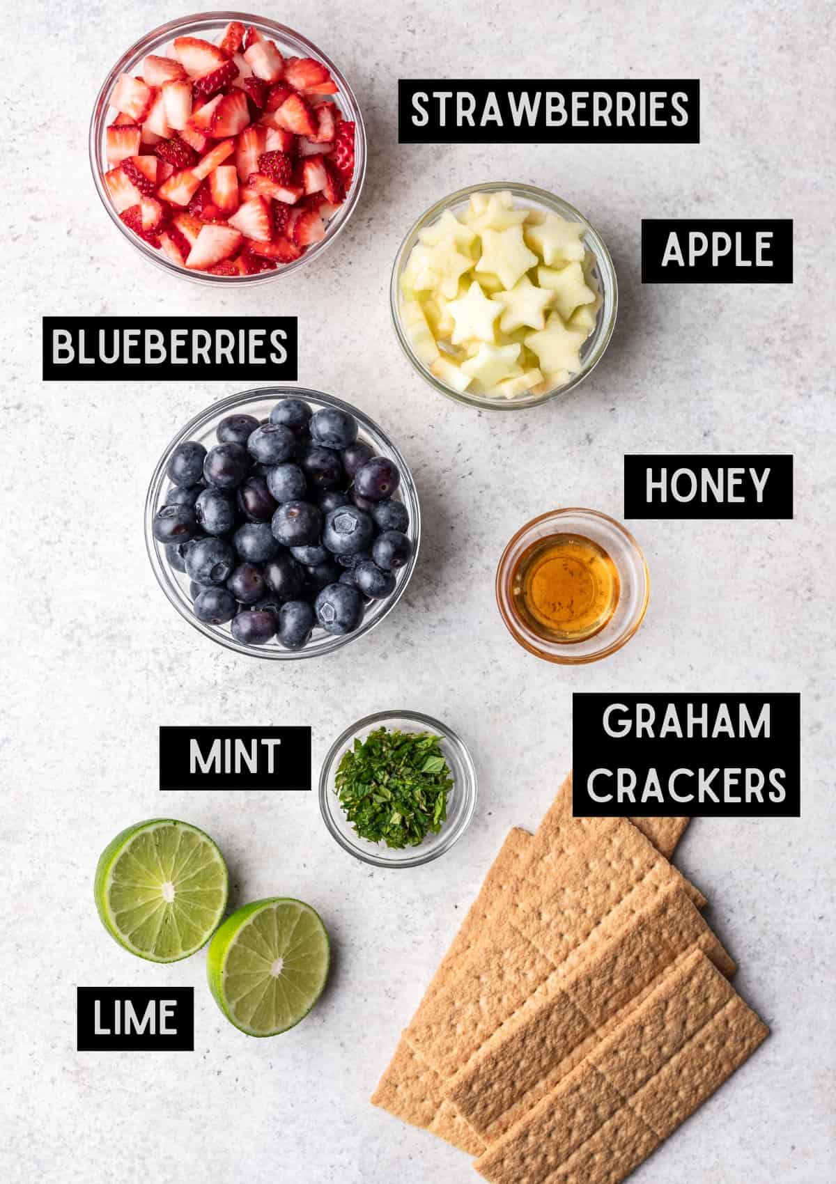 Labelled ingredients for red, white, and blue fruit salsa (see recipe for details).