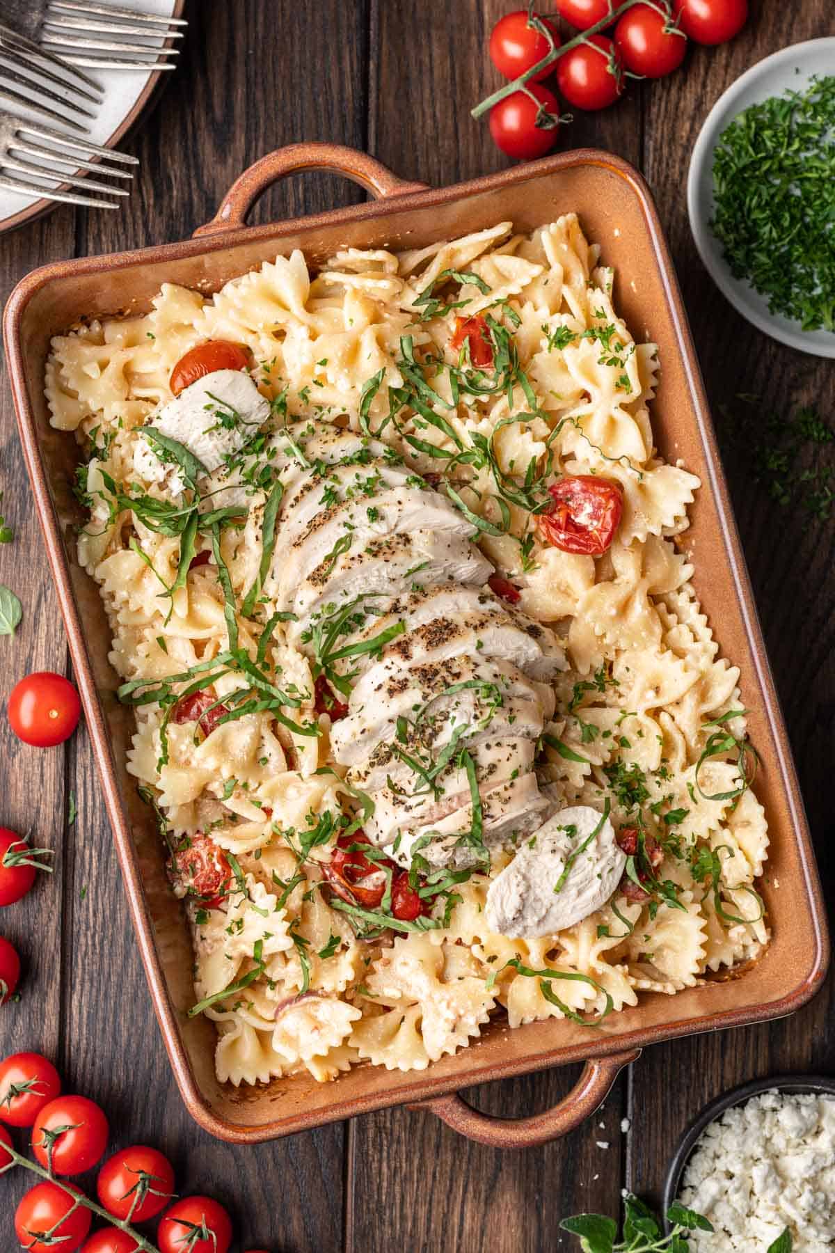 Baked feta chicken pasta in a baking dish.