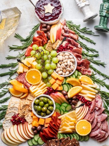 Christmas charcuterie board shaped like a Christmas tree.