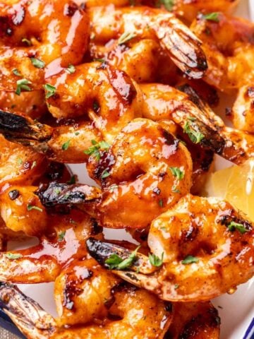 Shrimp with BBQ sauce on a platter.