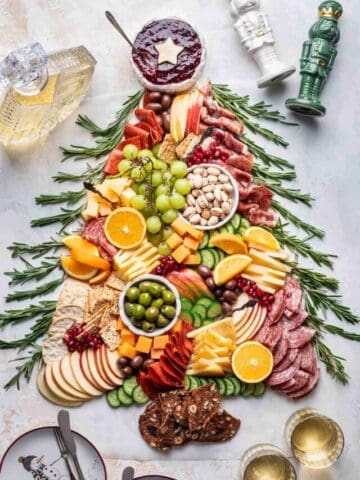 Christmas charcuterie board shaped like a Christmas tree.
