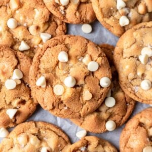 White chocolate macadamia nut cookies stacked on each other.