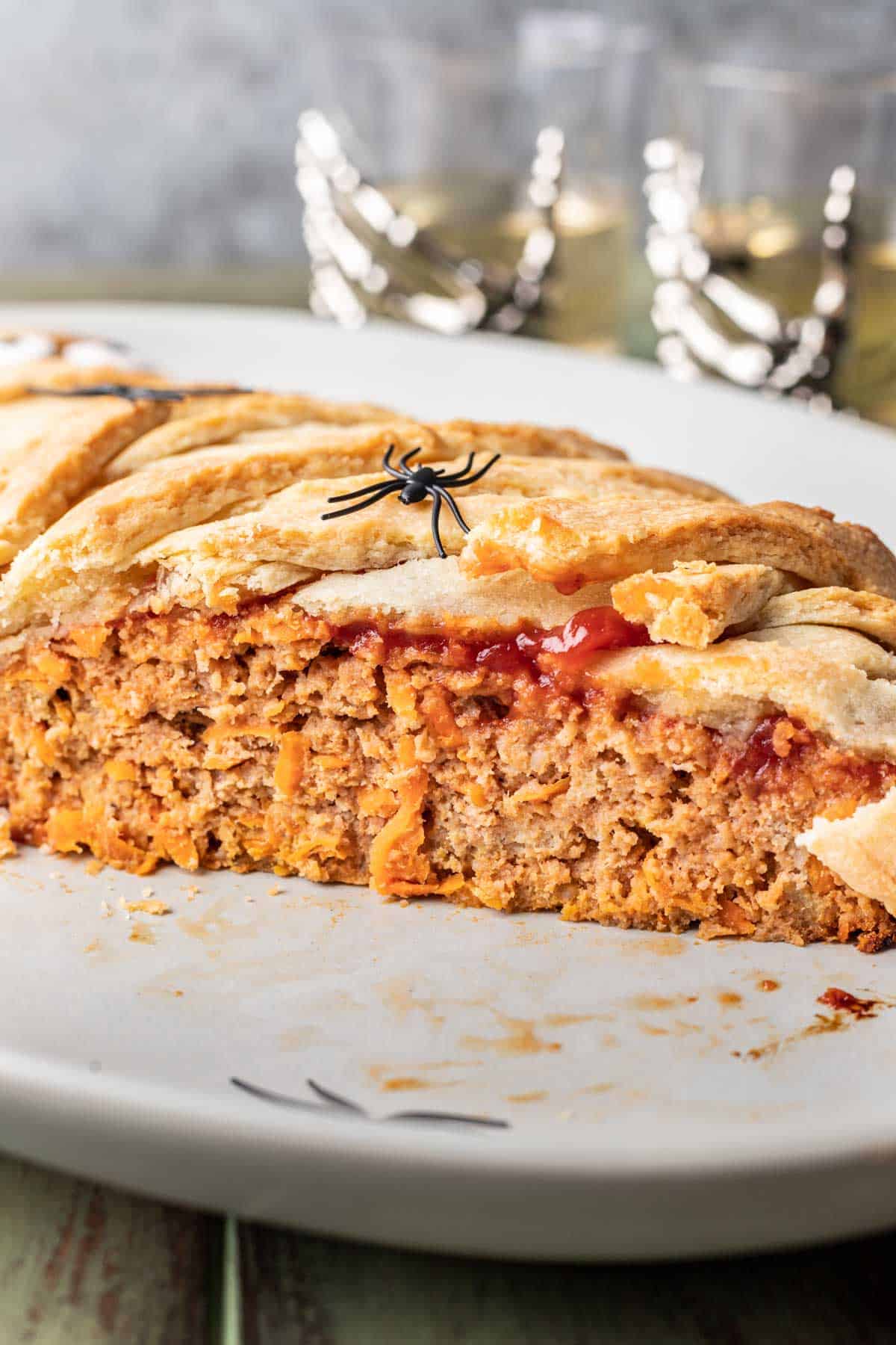 Sliced mummy meatloaf to show the internal texture of the meat.