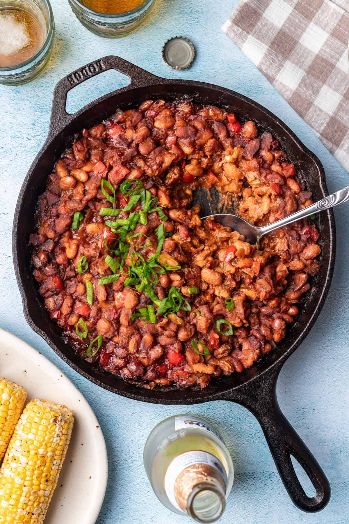 Smoked baked beans, corn, and beer ready for your next backyard get-together.
