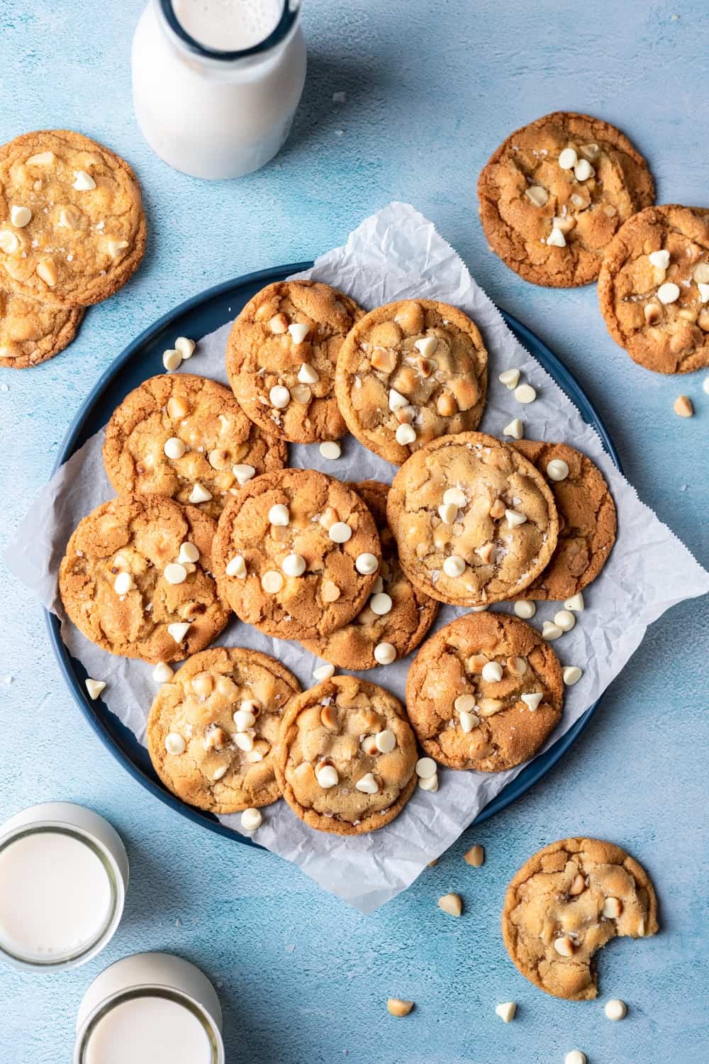 White chocolate macadamia cookies on a blue serving plate.