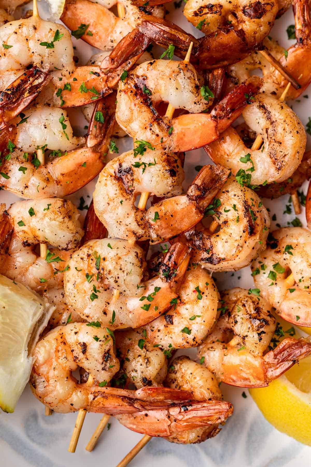 Smoked shrimp stacked on a platter.
