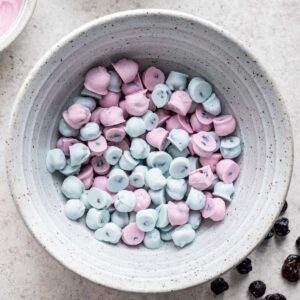 Blue and pink Yogos in a bowl.