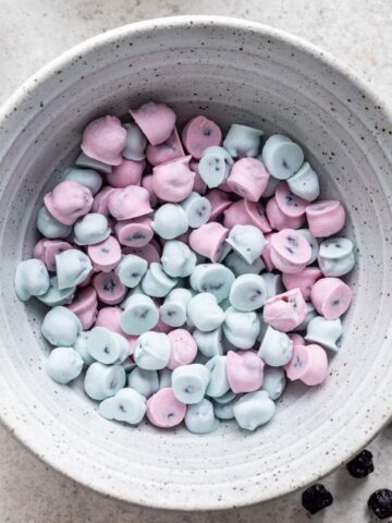 Blue and pink Yogos in a bowl.