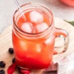 Dye free homemade kool aid in a cup with ice.