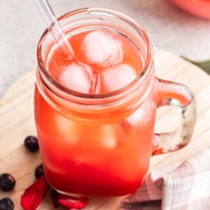 Dye free homemade kool aid in a cup with ice.