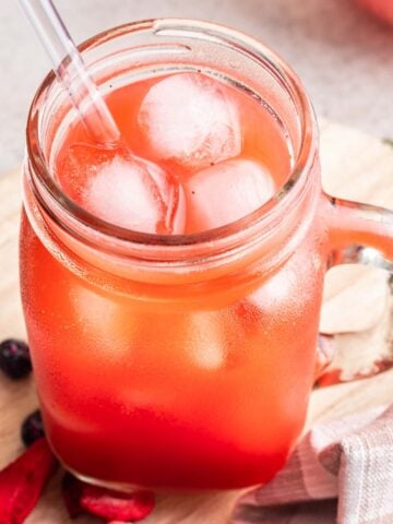 Dye free homemade kool aid in a cup with ice.