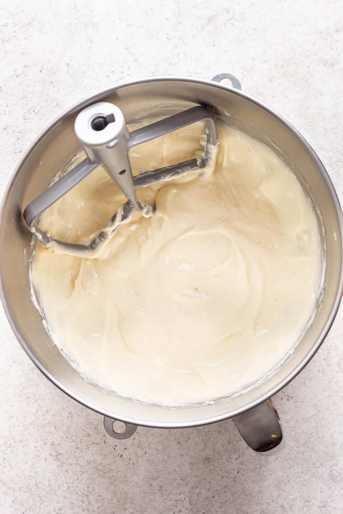 Cheesecake batter mixed in a mixing bowl.