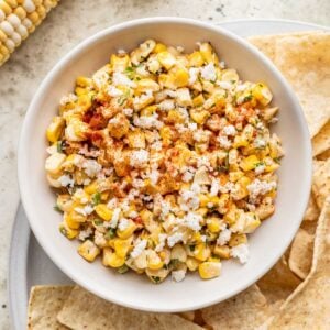 Street corn salsa in a white bowl.