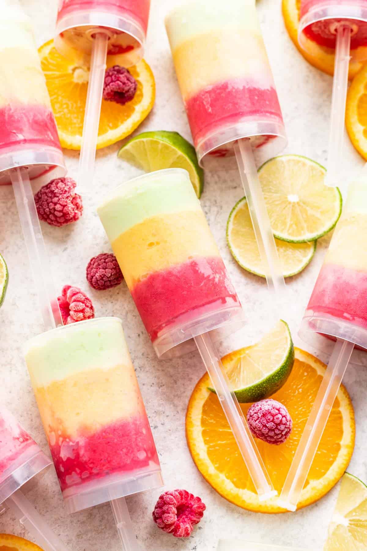 Healthy push up popsicles with homemade raspberry, mango, and lime sherbet.