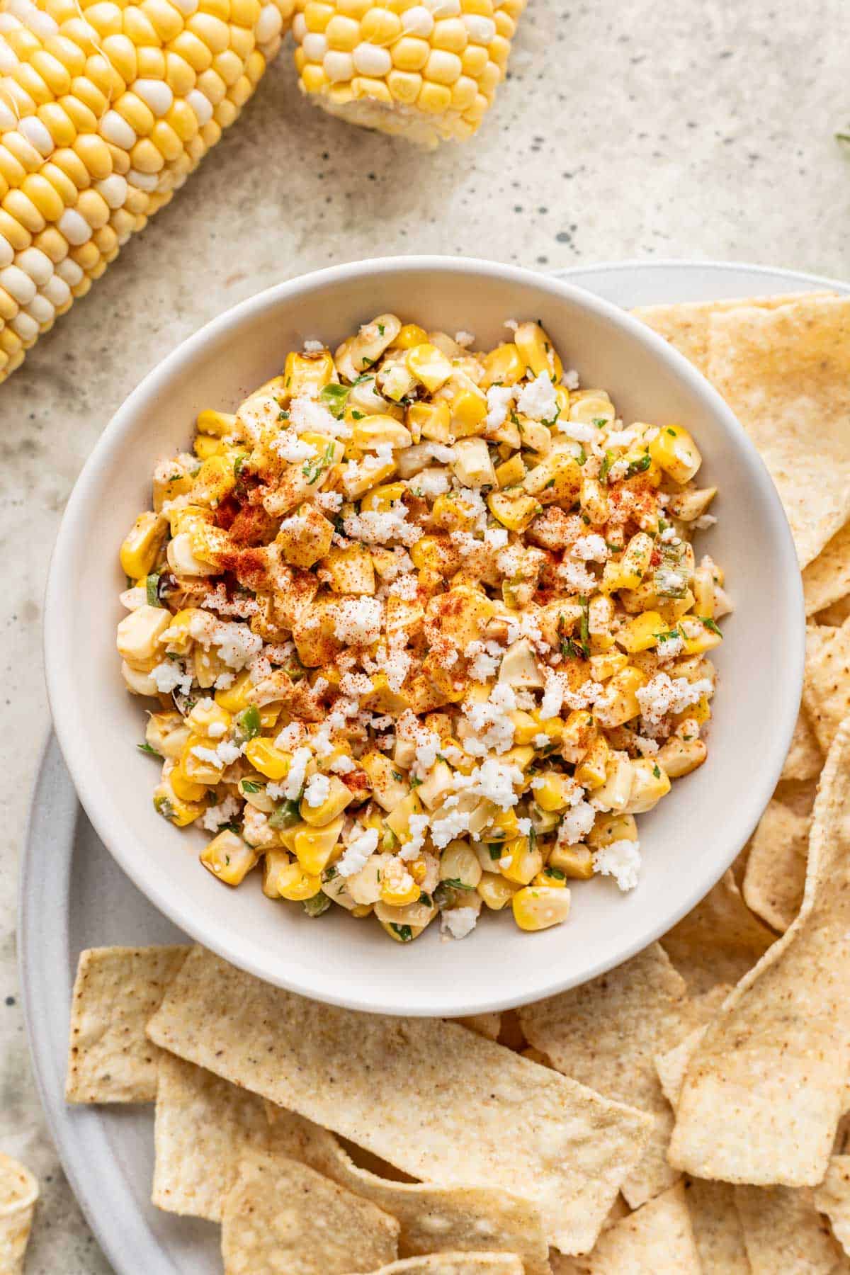 Street corn salsa in a white serving bowl.