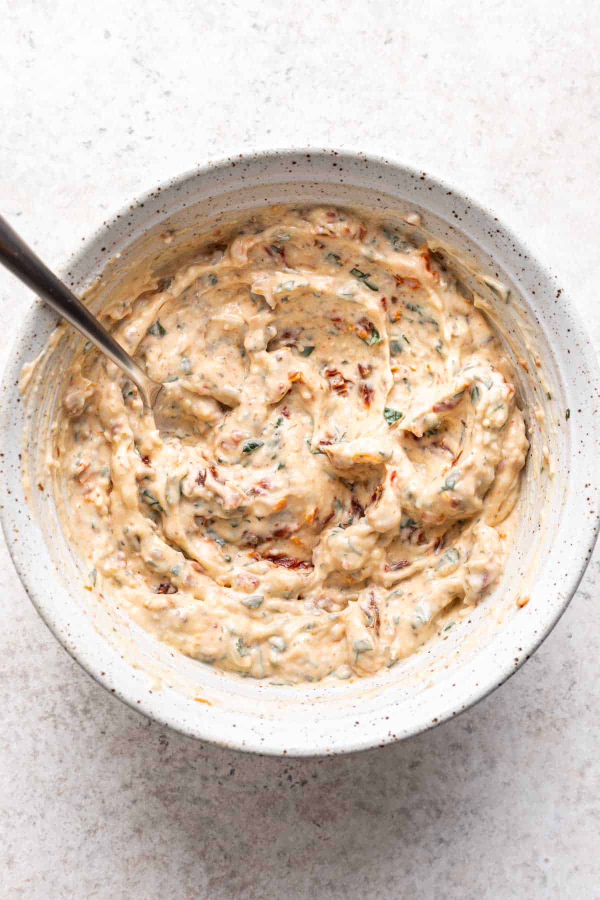 Sun dried tomato aioli mixed in a bowl.