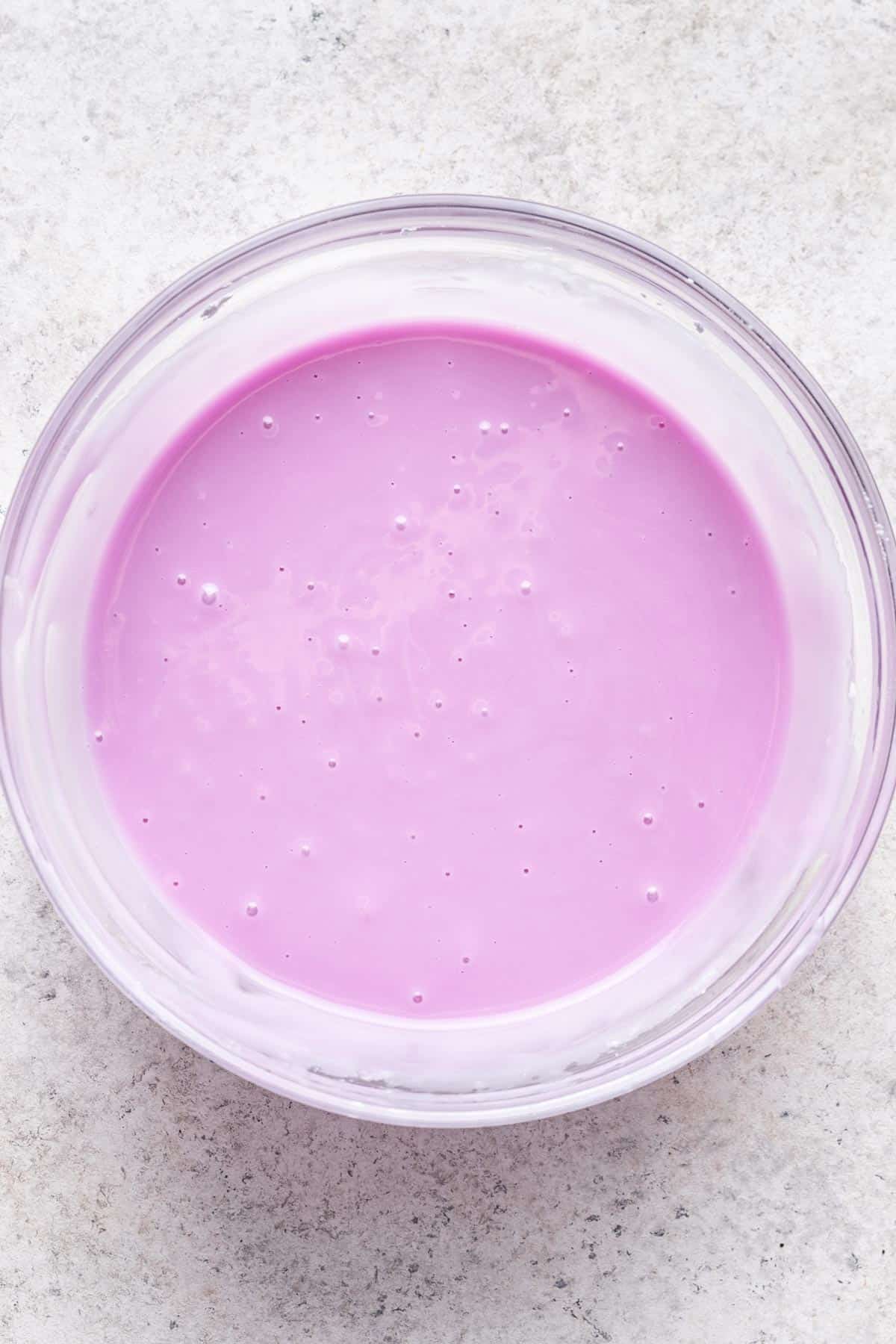 Purple glaze in a clear glass bowl.