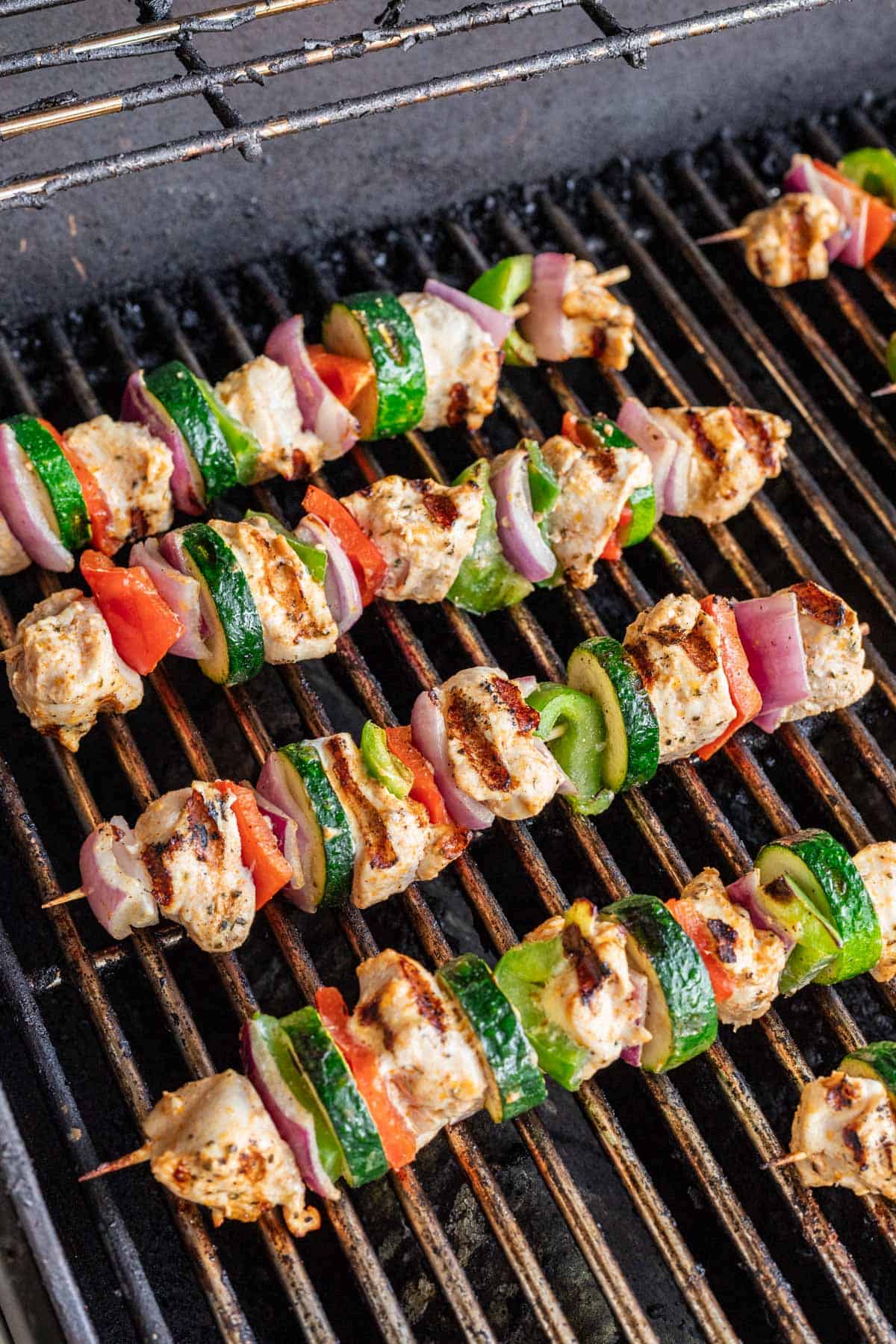 Yogurt marinated chicken skewers on the BBQ grill.