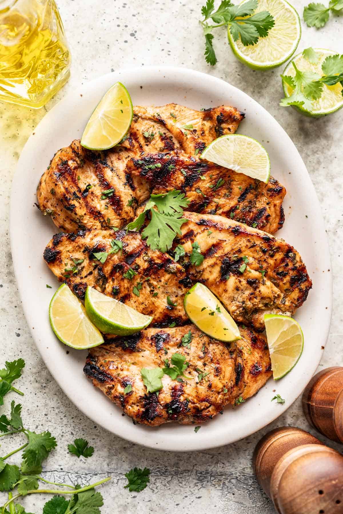 Grilled cilantro lime chicken on a serving platter.
