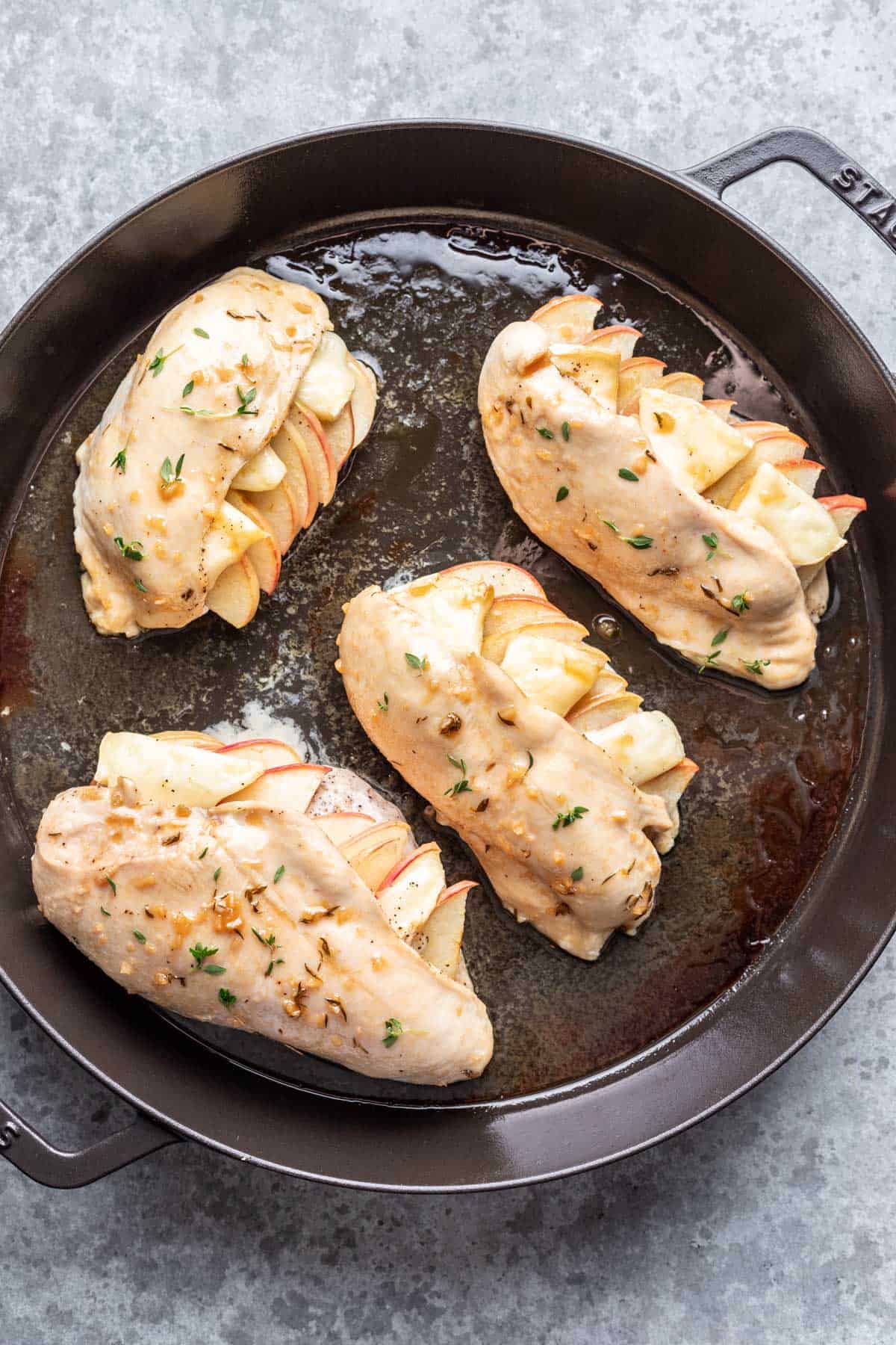 Apple cider glaze brushed on apple and brie stuffed chicken.