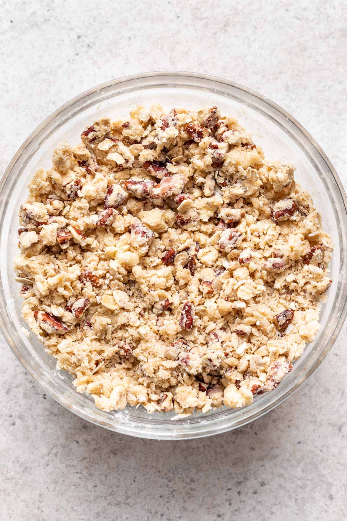 Butter cut into the flour, pecans, and oat mixture.