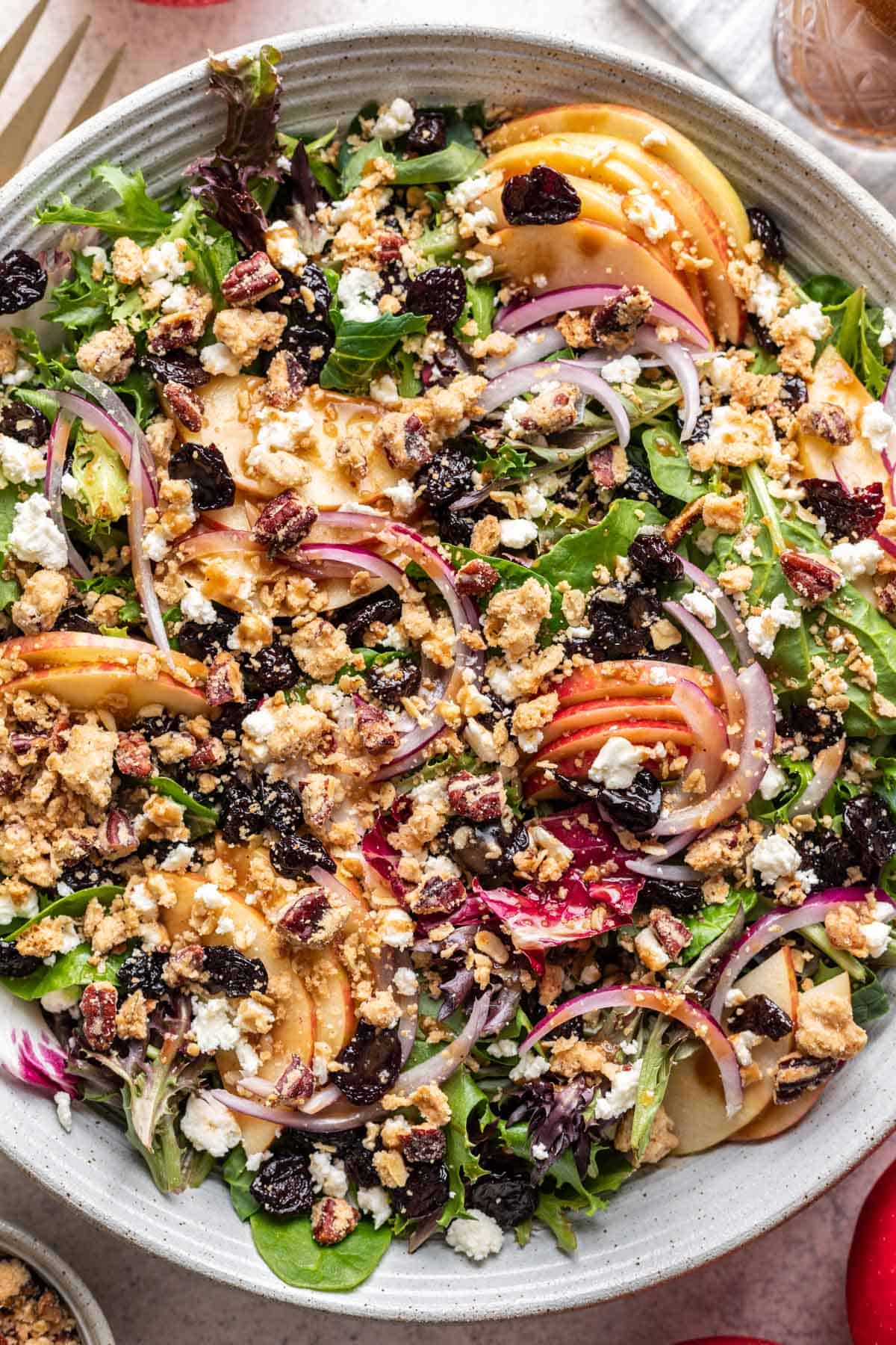Apple crisp michigan salad drizzled with balsamic dressing.
