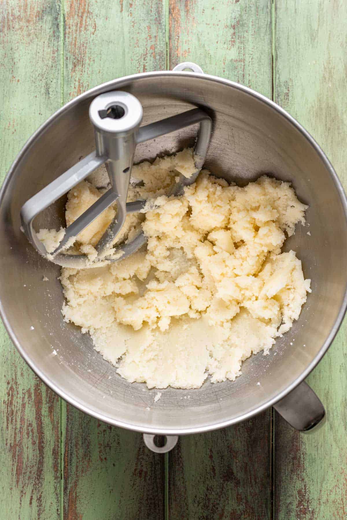 Butter and sugar beaten together in a mixing bowl.