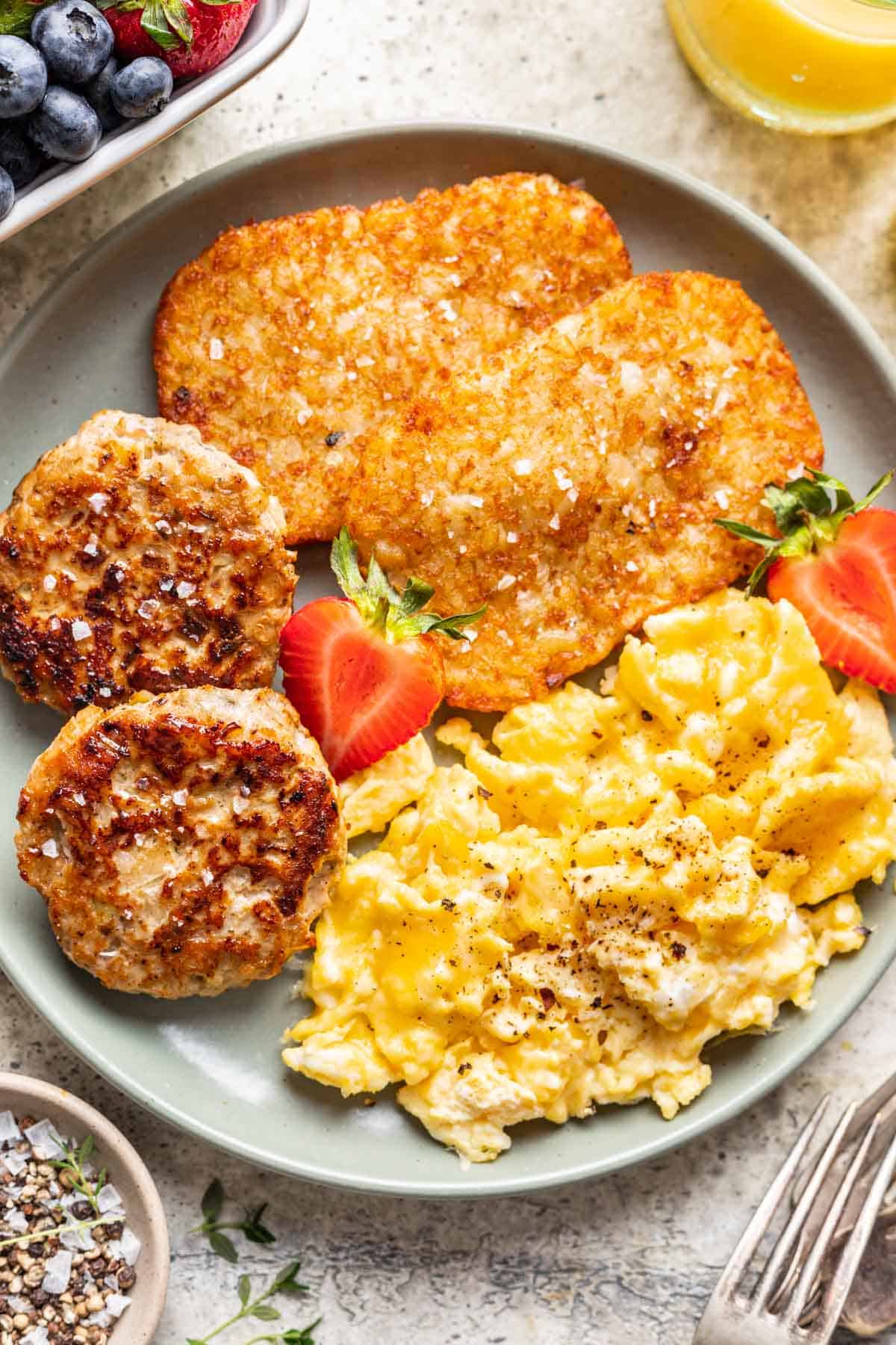Chicken and apple breakfast sausage with eggs and hashbrowns.
