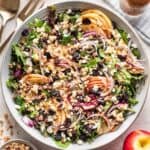 Apple Crisp Michigan Salad with sliced apples, crisp topping, onions, feta, and dried cherries.