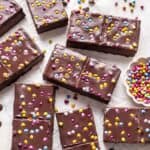 Homemade cosmic brownies on a white backdrop.