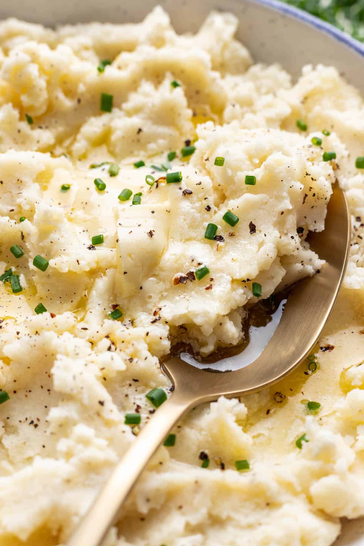 Greek yogurt mashed potatoes scooped with a spoon.