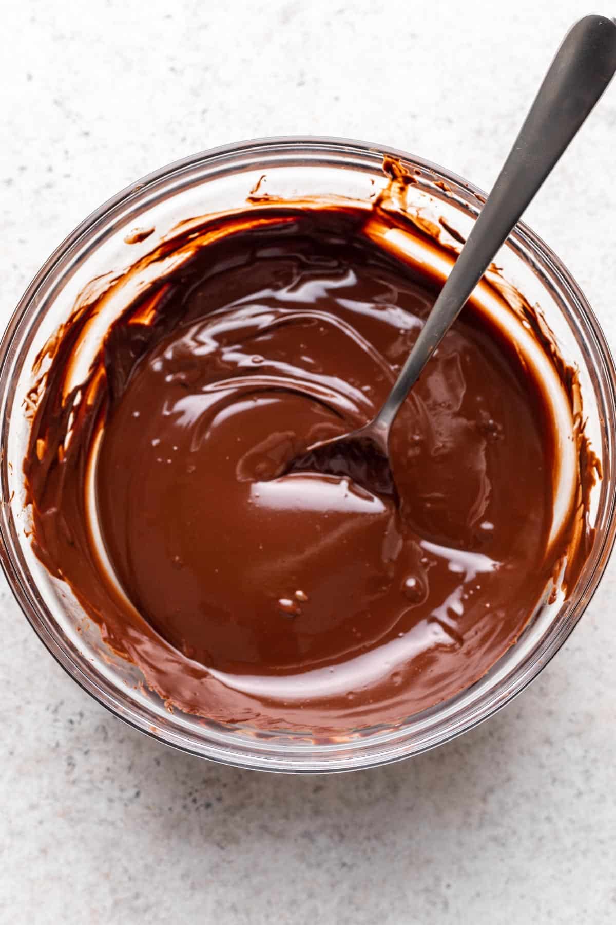 Melted semisweet chocolate in a glass bowl.